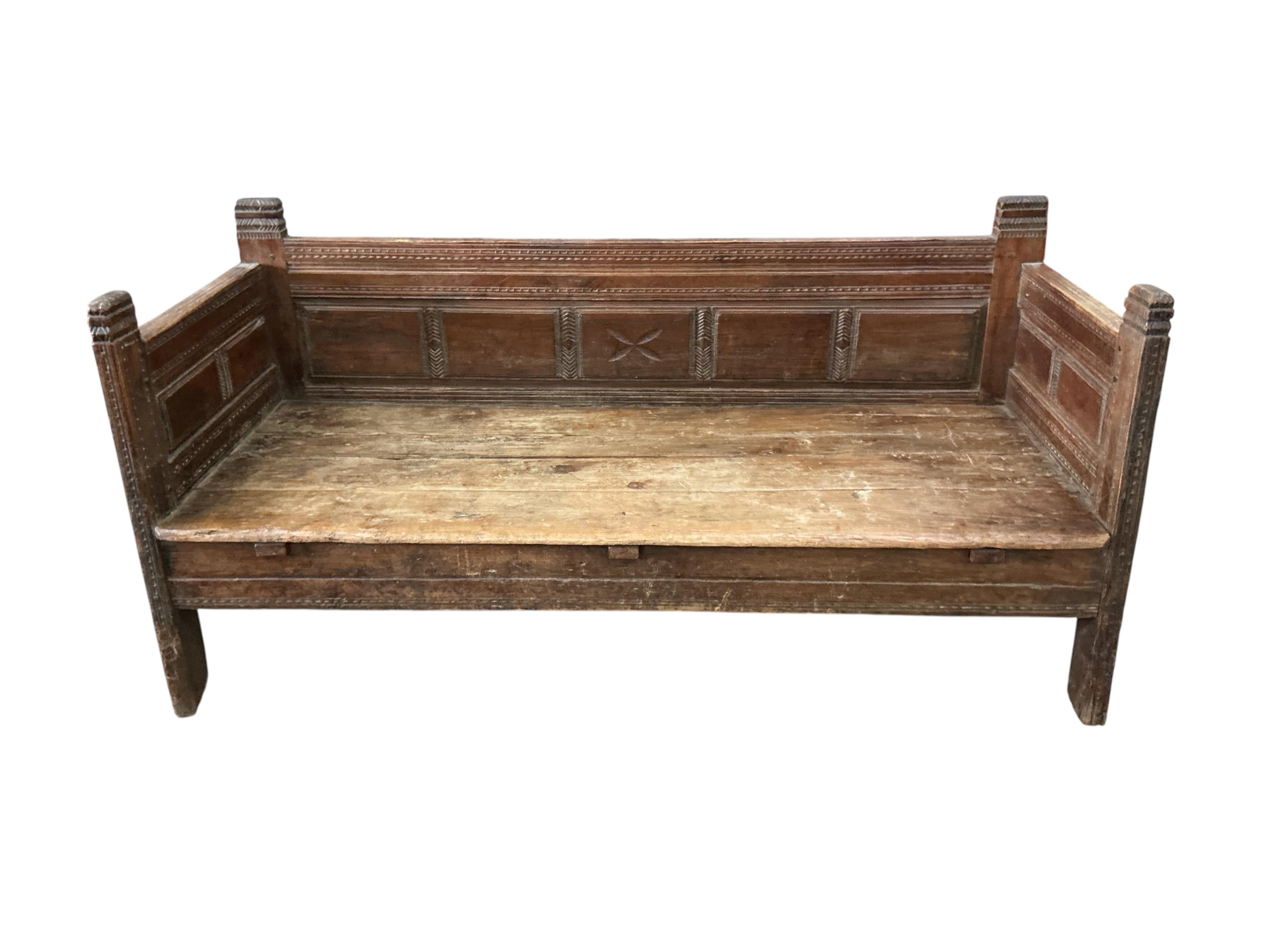 A 19th century Continental hardwood settee with upholstered cushions, width 190cm, depth 76cm, height 89cm, Provenance: The late Kenneth Turner (1936-2025), celebrity florist, designer and perfume retailer, he received t